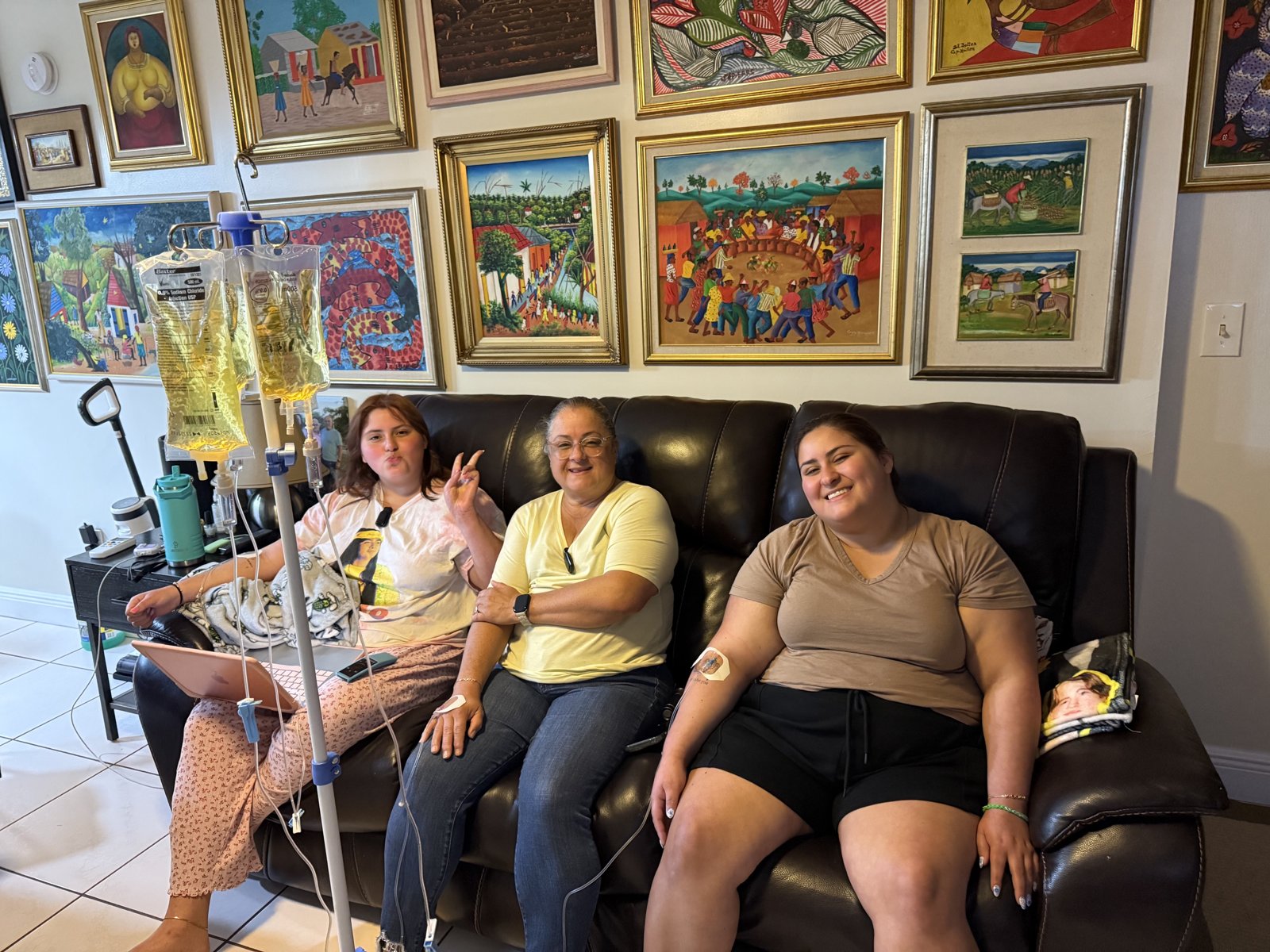 Family receiving IV hydration together at home in Miami