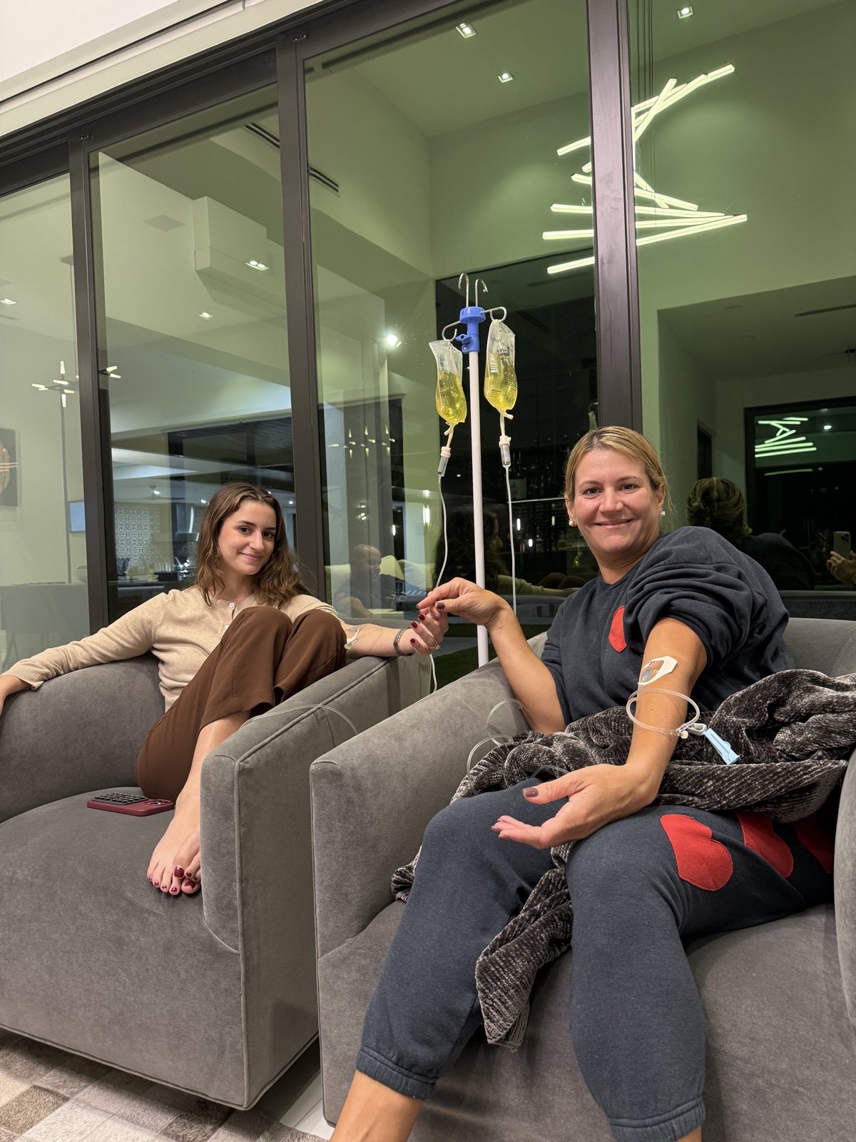 Clients relaxing during a ReVibe IV session at home
