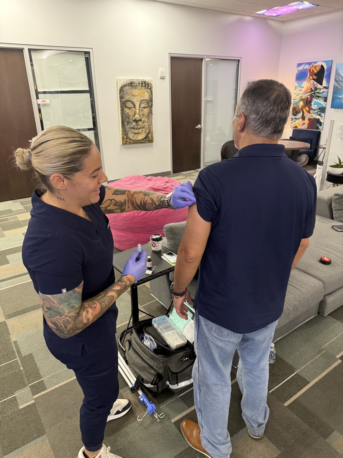 ReVibe nurse practitioner starting an IV for a client